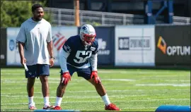  ?? Photo by Joe Jacobs ?? Patriots linebacker Elandon Roberts works with linebacker­s coach Jerod Mayo, left, during training camp earlier this summer.