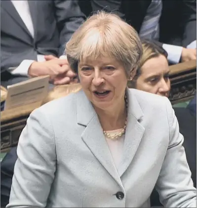  ?? PICTURES: PA WIRE. ?? BORDER BOTHER: Prime Minister Theresa May faces questions on the practicali­ty of her plans in the Commons.