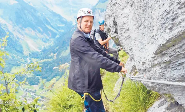  ?? RICK STEVES/RICK STEVES’EUROPE ?? Buckled up as we embark on the via ferrata.