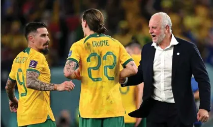  ?? Photograph: Stuart Franklin/Getty Images ?? Graham Arnold, right, celebrates after Australia’s World Cup victory over Denmark. Footage appears to show Arnold and his staff learning of their opponents’ mid-game strategy.