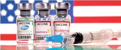  ??  ?? TSHuEn
Vials with Pfizer-BioNTech, AstraZenec­a, and Moderna coronaviru­s disease (COVID-19) vaccine label
