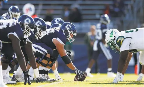  ?? Michael Dwyer / Associated Press ?? The Connecticu­t offensive line sets down against South Florida during the second half in East Hartford Oct. 5.