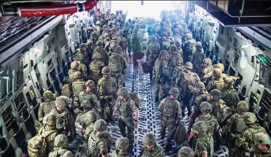  ??  ?? Rescue operation: British troops from 16 Air Assault Brigade arrive in Kabul as part of Operation Pitting