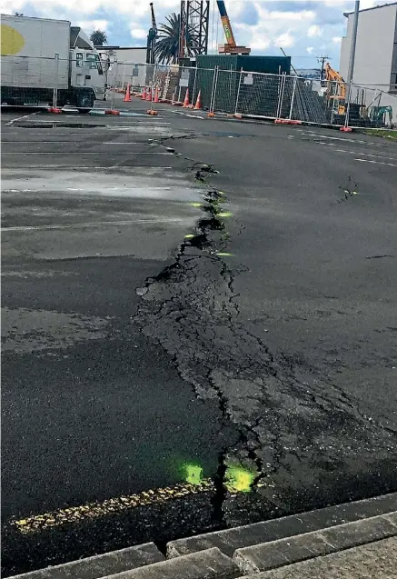  ?? LAINE MOGER/STUFF ?? A crack in Rawene car park exacerbate­s a row between business owners and AT.