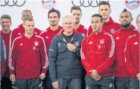  ??  ?? New Bayern Munich coach Jupp Heynckes, centre, poses with his players.