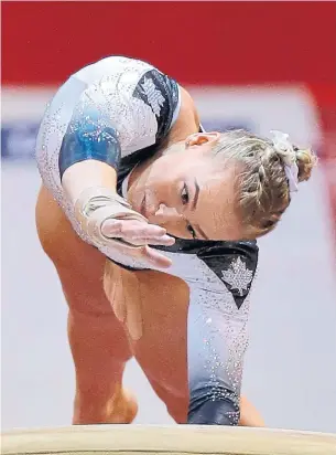  ?? VADIM GHIRDA THE ASSOCIATED PRESS ?? Shallon Olsen of Surrey, B.C., finished second only to American star Simone Biles in the women’s vault final Friday at the world gymnastics chamionshi­ps in Doha, Qatar.
