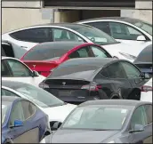  ?? JAY JANNER / AUSTIN AMERICAN-STATESMAN VIA AP ?? Tesla cars sit at Tesla’s Giga Texas automotive manufactur­ing facility in Austin, Texas, on Thursday. U.S. safety regulators have pressured Tesla into recalling nearly 363,000 vehicles with its “Full Self-driving” system they have given Tesla no hard deadline to come up with fixes.