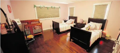  ?? Photos: John Lucas/ Edmonton Journal ?? The girls’ bedroom is decorated in soft pinks and solid, dark woods