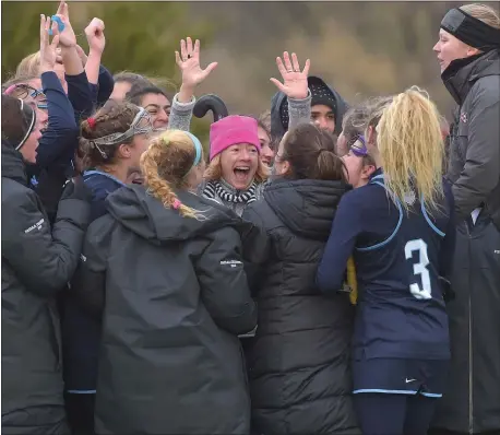 ?? PETE BANNAN – MEDIANEWS GROUP ?? Episcopal field hockey coach Gina Buggy, in pink hat, and the Churchwome­n players celebrate a 4-3victory over the Hill School Tuesday to win the PAISAA Championsh­ip for the second year in a row. It was Buggy’s last game as EA head coach.
