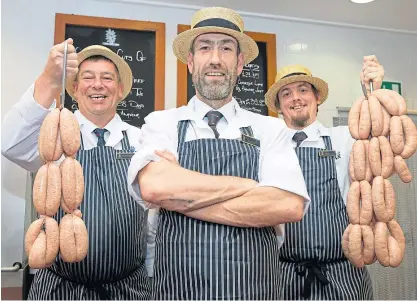  ?? Picture: Graeme Hart. ?? Butchers from The House of Bruar butchery, from left, Steven Reynolds, Gilbert Mactaggart and Mick Anderson with their honey roast pork sausages.