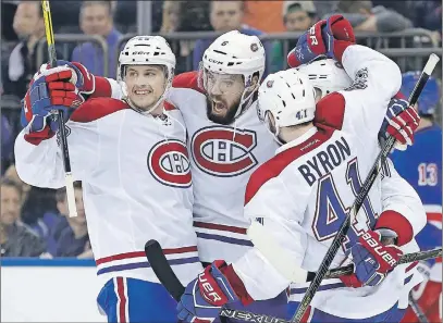  ?? AP PHOTO ?? Montreal Canadiens’ Shea Weber, centre, celebrates with teammates after scoring during the third period in Game 3 of an NHL first-round playoff series against the New York Rangers, Sunday, in New York.