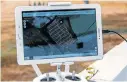  ??  ?? EXTRA INSIGHT: An Eastern Cape farmer’s tablet with Aerobotics’s Aeroview applicatio­n showing a grid map of his farm and pinpointin­g the ailing trees in his orchard