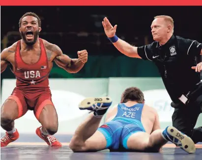  ?? CHARLIE NEIBERGALL/AP ?? Jordan Burroughs, left, competing in the freestyle wrestling World Cup in 2018, says, “Every Olympic Games gets bigger.” He won gold in the 2012 Games in London.