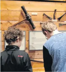  ??  ?? Thomas and Daniel Duke try out some of the interactiv­e exhibits at the Museum of Industry in Stellarton, N.S.
