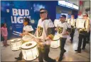  ??  ?? The Knight Line Drumbots parade through the concourse level of T-mobile Arena before the Golden Knights’ March 28 game against the Arizona Coyotes.