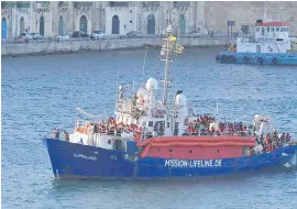  ??  ?? The ship operated by German aid group Mission Lifeline, carrying 234 migrants, arrives at the Valletta port in Malta, on Wednesday, after a journey of nearly a week while awaiting permission to dock.