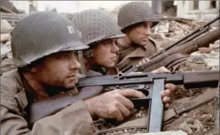  ??  ?? Tom Hanks, left, as Captain Miller, Matt Damon as Private Ryan and Edward Burns as Private Reiben in “Saving Private Ryan,” a visceral evocation of the chaos of war.