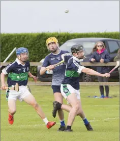  ??  ?? Bray defenders Fiachra O’Dunai and Tim Harrington stop Michael Dwyer’s Rory Martin during the Minor ‘A’ semi-final played in Dunbur Park last weekend.