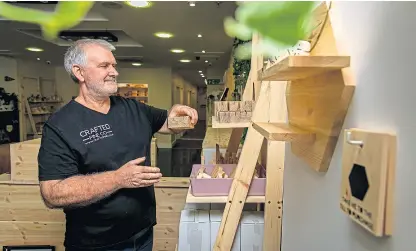  ?? Pictures: Steve Brown. ?? Top: Don sets up his new store which will be rent and rates-free for a year and officially opens today. Above: A selection of the decorative goods.