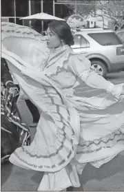  ?? File, Kristina Wilder / Rome News-Tribune ?? Traditiona­l folk dancers, like Maria Bucio shown in the 2015 parade, will perform during Sunday’s parade down Broad Street in honor of Our Lady of Guadalupe.