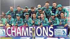  ??  ?? Pakistani cricketers pose for a photograph with trophy after winning the third and final Twenty20 Internatio­nal match against World XI at the Gaddafi Cricket Stadium in Lahore - AFP