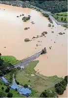  ?? ?? Hikurangi was still flooded midweek as many roads were still blocked by felled trees and slips.