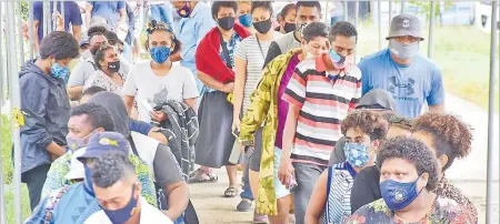  ?? Picture: ATU RASEA ?? Residents of Nasinu queue up seated and standing during the vaccinatio­n drive at the FNU Nasinu campus yesterday.