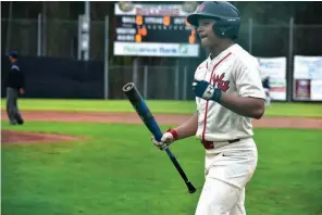  ?? (Pine Bluff Commercial/I.C. Murrell) ?? Braylon Johnson of White Hall picks up a bat after scoring the tying run on a second-inning single against Hot Springs Lakeside on Tuesday at White Hall High School.