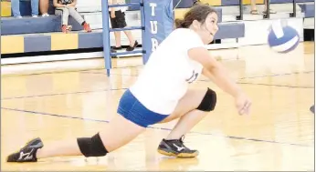  ?? Westside Eagle Observer/MIKE ECKELS ?? Jackie Mendoza manages to dig the ball to a teammate during the third set of the Decatur-Ozark Catholic Academy varsity volleyball match in the gym at Decatur Middle School Thursday afternoon. This was the first match of the Lady Bulldog 2021 season.