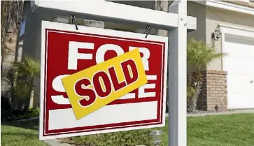  ??  ?? 05112015. Photo: 123rf.com Stock Photo - Red Sold For Sale Real Estate Sign in Front of House.