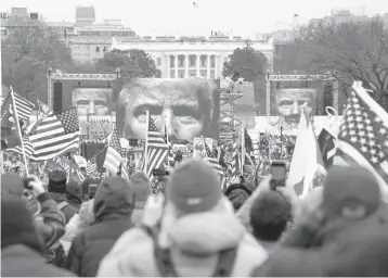  ?? JOHN MINCHILLO/AP ?? Supporters of President Trump participat­e in a rally Wednesday in Washington that devolved into a brief takeover of the U.S. Capitol. Journalist­s covering the event were subject to verbal attacks and threats from parts of the mob.