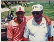  ??  ?? The young Tiger Woods and his father, Earl, circa 1995, are seen in a photo used in part one of the HBO documentar­y “Tiger.”