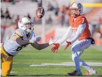  ?? ROBERTO E. ROSALES/JOURNAL ?? UNM receiver Anselem Umeh, right, can only watch as a pass intended for him nearly bounces into the hands of Wyoming’s Marcus Epps during the Lobos’ 31-3 loss on Saturday.