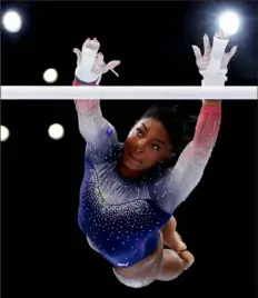  ?? Naomi Baker/Getty Images ?? Simone Biles now has 26 world champinshi­ps medals — 20 of them gold.