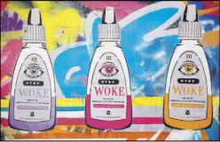  ??  ?? “Genetic Carnage” is a comment on Chiquita banana, above; Artist Isaac Zevalking at work; “Stay Woke” is a play on eye drops and a social activism term, left.