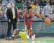  ?? [ROD AYDELOTTE/WACO TRIBUNE-HERALD VIA AP] ?? Oklahoma guard Rashard Odomes comes up with a steal over Baylor guard Jared Butler during Monday night's game in Waco, Texas.