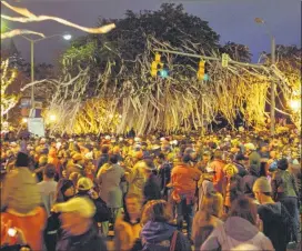  ?? OPELIKA-AUBURN NEWS 2007 ?? The “rolling” of the trees at Toomer’s Corner with toilet paper after an Auburn win started with a 1972 Iron Bowl victory over No. 2-ranked Alabama.