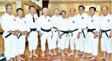  ??  ?? SSKA Team with 8th Dan Sensei Masanori Nagata (4th left), Grand Master Sensei David Wang (4th right) and Sensei Peter Chung MSKF president (1st right).