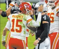  ?? Heidi Fang Las Vegas Review-journal @Heidi Fang ?? Dueling quarterbac­ks Patrick Mahomes and Derek Carr likely exchange words of praise after Sunday night’s game, a 35-31 Kansas City victory at Allegiant Stadium.