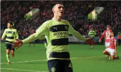  ?? ?? Phil Foden of Manchester City celebrates after scoring his second goal of the game against Bristol City at Ashton Gate. Photograph: Shaun Botterill/Getty Images