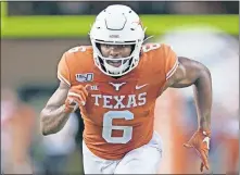  ??  ?? Texas receiver Devin Duvernay could be a main target for quarterbac­k Sam Ehlinger on Saturday. [AP PHOTO/CHUCK BURTON]