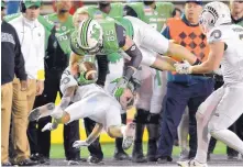  ?? JIM THOMPSON/JOURNAL ?? Marshall’s Ryan Yurachek (85) gets upended in the final minutes of Saturday’s Gildan New Mexico Bowl at Dreamstyle Stadium.