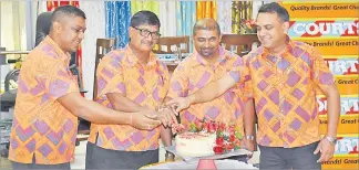  ?? Picture: ATU RASEA ?? Courts senior retail manager Ronil Sharma left, general manager retail Hamendra Prasad, retail manager Bengamin Mohammed and CEO Sanjesh Prasad cut the cake during the birthday celebratio­n at the Rodwell Road branch in Suva.