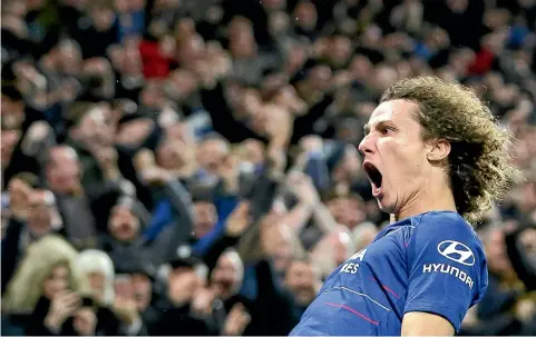  ?? AP/GETTY IMAGES ?? David Luiz celebrates after scoring the second goal in Chelsea’s 2-0 victory over Manchester City yesterday.