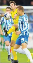  ??  ?? LUNGE: Charlie Wyke and Danny Hollands battle