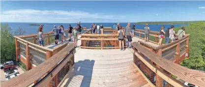  ?? ?? People take in the views from Peninsula State Park’s Eagle Tower in Door County on May 22, 2021.