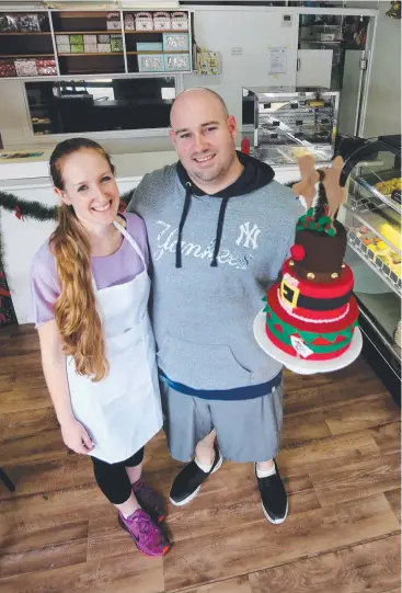  ?? Picture: STEWART McLEAN ?? IT’S A GIFT: Deckerdenc­e Bake House owners Emma and Shawn Decker will open their doors on Christmas Day to serve lunch to those less fortunate.