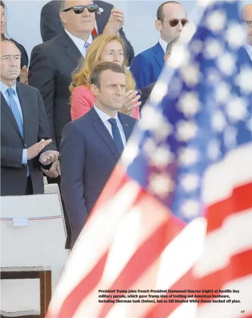  ??  ?? President Trump joins French President Emmanuel Macron (right) at Bastille Day military parade, which gave Trump idea of trotting out American hardware, including Sherman tank (below), but as bill bloated White House backed off plan. AP