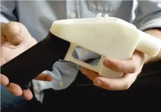  ?? AP FILES ?? A plastic pistol that was completely made on a 3D printer at a home in Austin, Texas.