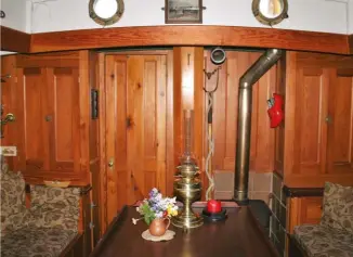  ?? ?? Above right: Looking aft in
saloon
Below left: Westernman. Note the table with flap extended and holes for taking fiddles at sea
Bottom right: Pitch-pine panelling and William Morris fabric combine to bring warmth and cosiness below